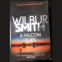Load image into Gallery viewer, A Falcon Flies by Wilbur Smith (Book 1 in the Ballantyne Series)
